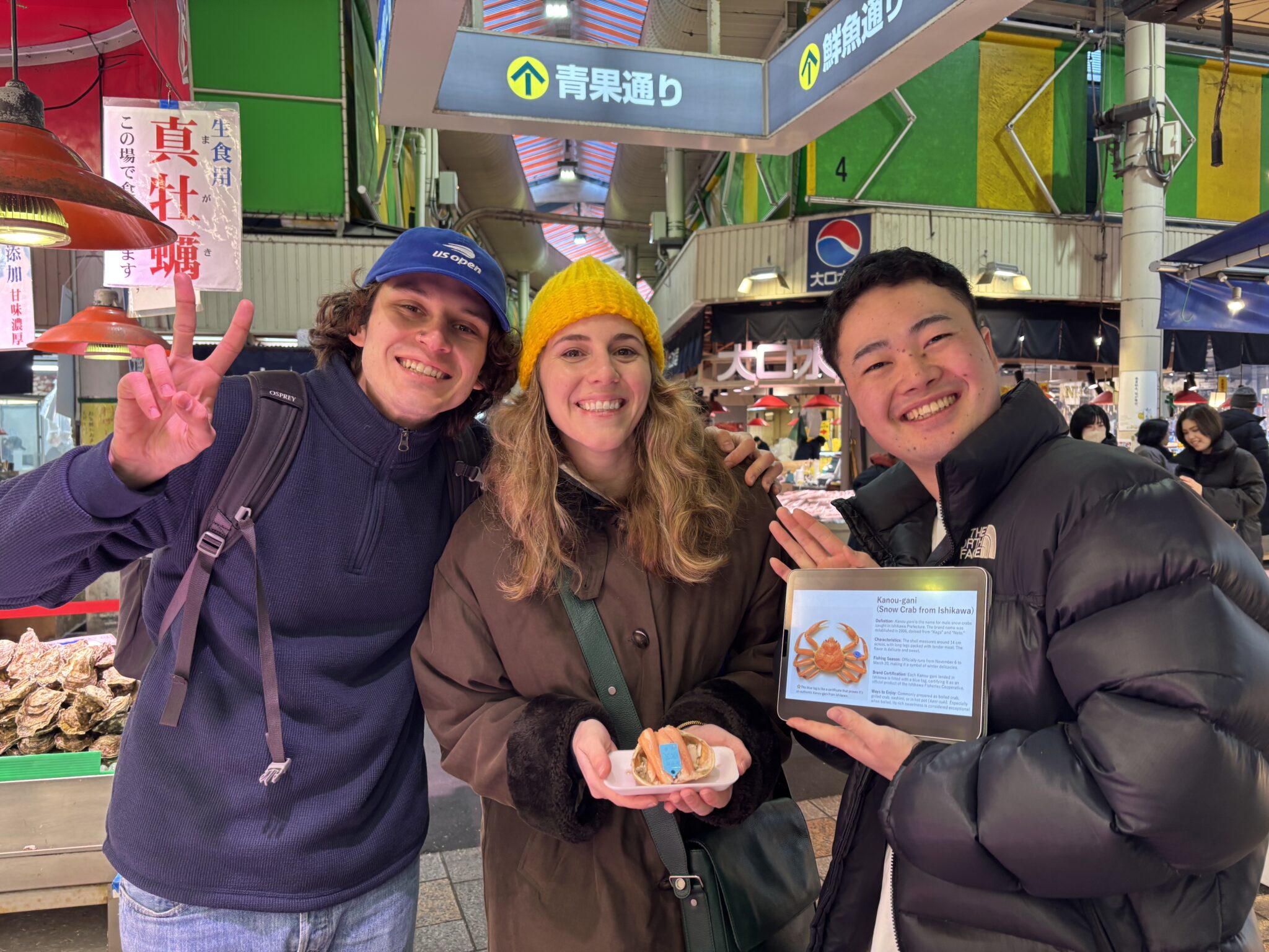 Guests enjoying a guided food experience at Omicho Market in Kanazawa