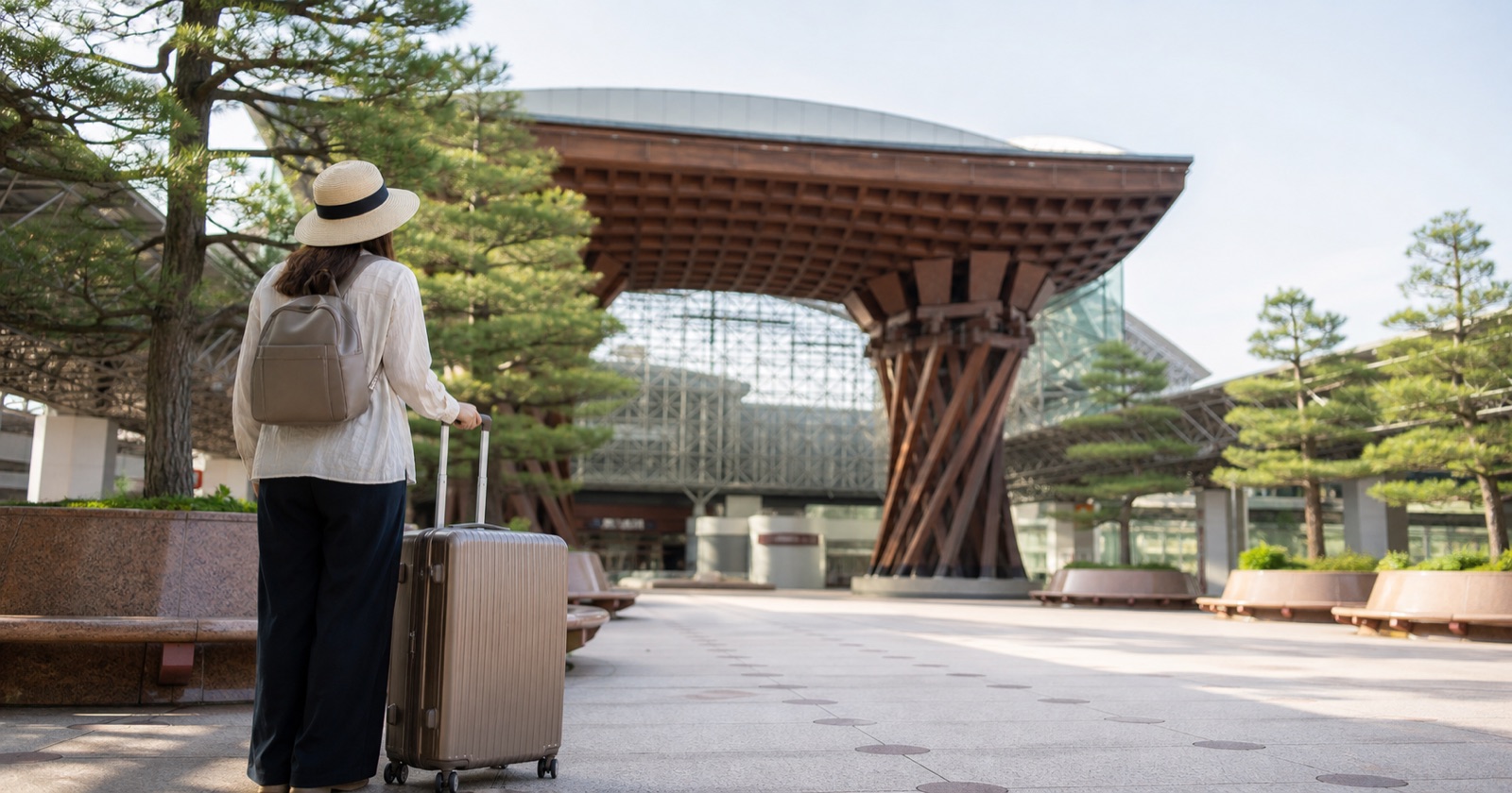 Traveler arriving at a Japanese railway station with luggage